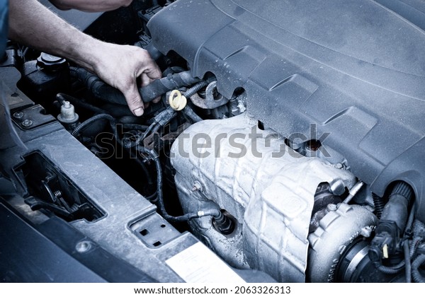 Car service\
auto. Automotive repair in garage workshop. Mechanic engine vehicle\
diagnostic. Technician\
maintenance
