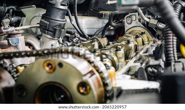 Car service\
auto. Automotive repair in garage workshop. Mechanic engine vehicle\
diagnostic. Technician\
maintenance