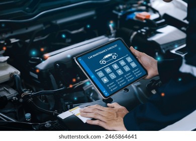 car service and checking concept. Hand of a mechanic holding the tablet for maintenance checklist vehicle, Software for manager check to repair, technology checkup automotive. Customer service concept - Powered by Shutterstock