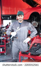 Car Service Concept , Repair, Maintenance Concept - Arab Auto Mechanic Man Or Smith Stand Beside A Car At Workshop Warehouse Before Start Checking A Car In The Garage For Maintenance Services