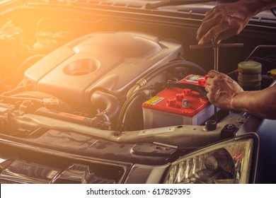 Car Service ,fitting A Car Battery With Wrench / Soft Focus Picture 