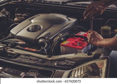 Car Service ,fitting A Car Battery With Wrench / Soft Focus Picture 