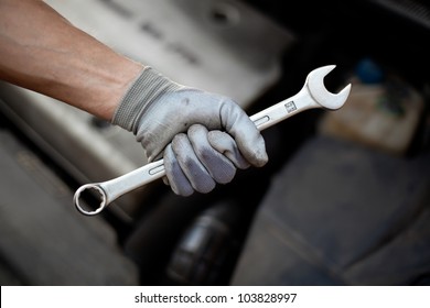 Car Service. Hand Holding Wrench.