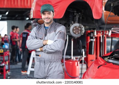 Car Service, Repair, Maintenance Concept - Arab Auto Mechanic Man Or Smith Stand Beside A Car At Workshop Warehouse Before Start Checking A Car In The Garage For Maintenance Services