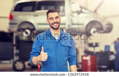 Similar – Image, Stock Photo Auto mechanic working in garage. Repair service.