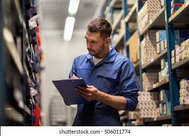 car service, repair, maintenance and people concept - auto mechanic man or smith writing to clipboard at workshop or warehouse - Shutterstock ID 506011774