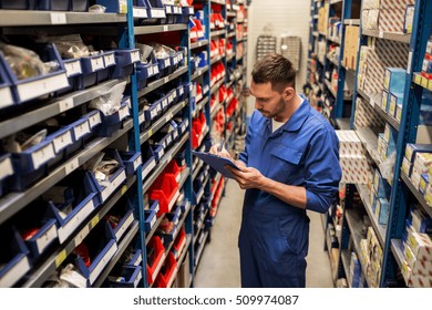 car service, repair, maintenance and people concept - auto mechanic man or smith writing to clipboard at workshop or warehouse - Shutterstock ID 509974087