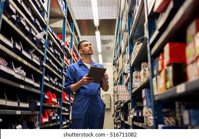 car service, repair, maintenance and people concept - auto mechanic man or smith with tablet pc computer looking for spares at workshop or warehouse
