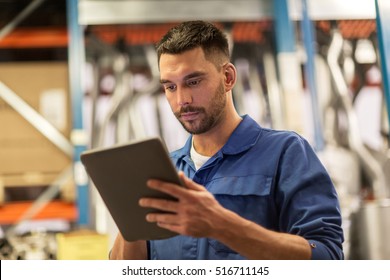 Car Service, Repair, Maintenance And People Concept - Auto Mechanic Man Or Smith With Tablet Pc Computer At Workshop Or Warehouse