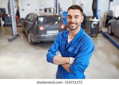 Car Service, Repair, Maintenance And People Concept - Happy Smiling Auto Mechanic Man Or Smith At Workshop