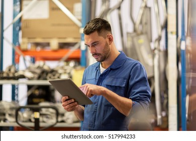 Car Service, Repair, Maintenance And People Concept - Auto Mechanic Man Or Smith With Tablet Pc Computer At Workshop Or Warehouse