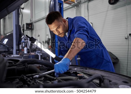 Similar – Image, Stock Photo Auto mechanic working in garage. Repair service.