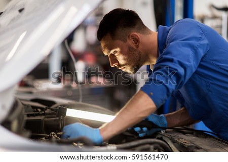 Similar – Image, Stock Photo Auto mechanic working in garage. Repair service.