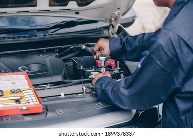 car service, repair, maintenance. A technician checks collect detailed information during work. service maintenance of industrial to engine repair