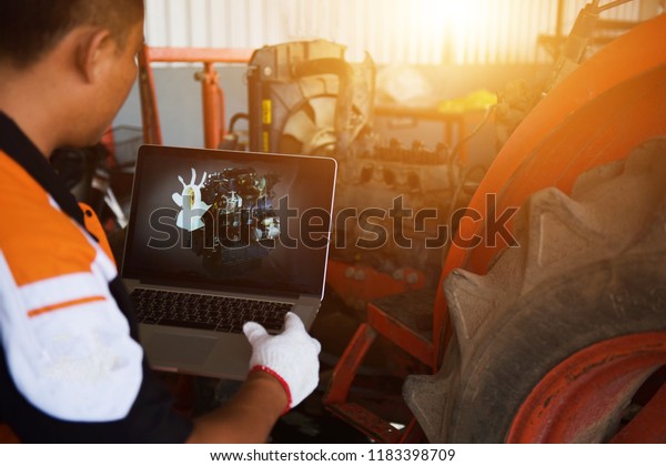 car service, repair, technology, maintenance and\
people concept - mechanic man with tablet pc computer making system\
diagnostic at workshop