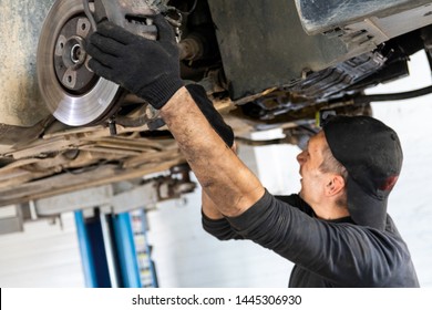 Car Service, Suspension Repair, Car On The Lift.