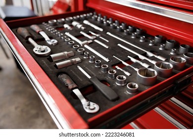 car service tools in tray of the red steel suitcase. Mechanic, equipment in garage Concept. - Powered by Shutterstock