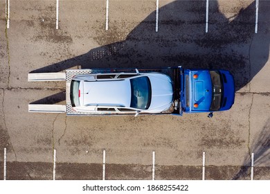 

Car Service Transportation Concept. Tow Truck Transporting Car On Motorway Freeway Highway. Help On Road Transports Wrecker Broken Car. Transportation Faults And Emergency Cars.
