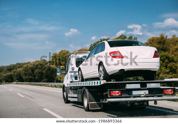 Car Service Transportation Concept. Tow Truck
Transporting Car Or Help On Road Transports Wrecker Broken Car.
Auto Towing, Tow Truck For Transportation Faults And Emergency Cars
. Tow Truck Moving In