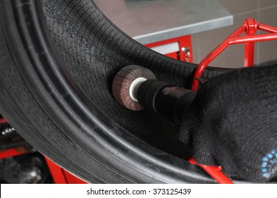 Car Service: Tyre Repair. The Worker Repair Of Tire - Vulcanization