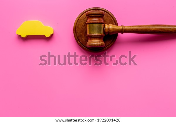 Car shape with judge gavel. Driving and insurance\
law concept