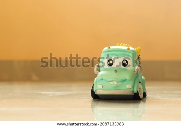 Car shaped\
jar for coin collecting money\
concept.