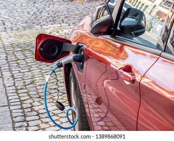 Car sharing electric car at charging station