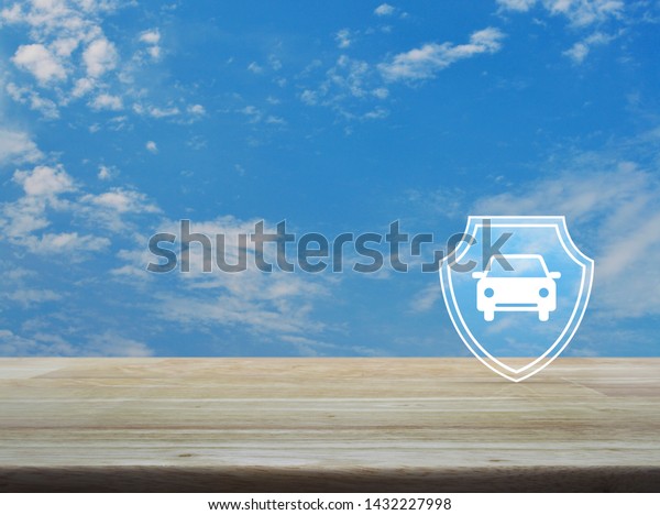 Car with\
shield flat icon on wooden table over blue sky with white clouds,\
Business automobile insurance\
concept