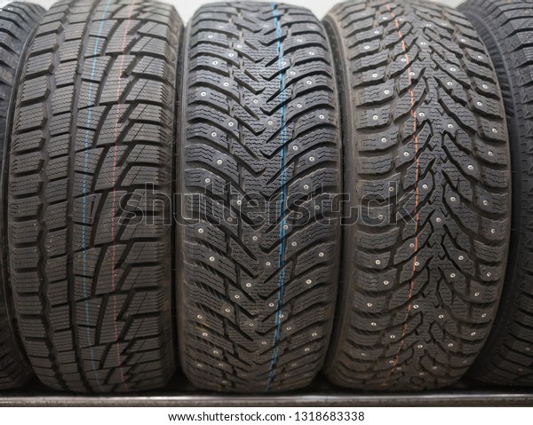 A car\
shop. Brand new clean wheels with studded\
tires