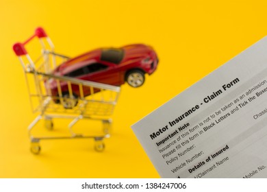 Car In A Shopping Cart And Insurance Document. Cheap Car Insurance Concept. Yellow Background