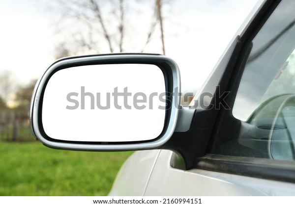 Car side mirror with white isolated background.\
Side view mirror.