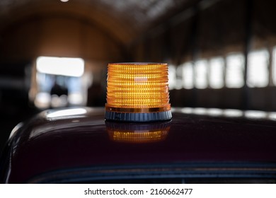 car siren beacon on the roof of the car in the hangar. - Shutterstock ID 2160662477