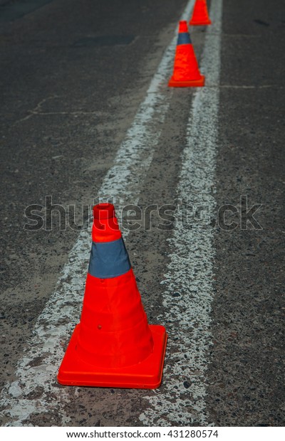 car slalom race course circuit Speed\
circuit. Red pepper close-up texture background. auto slalom,\
traffic cone on street used warning sign on\
road
