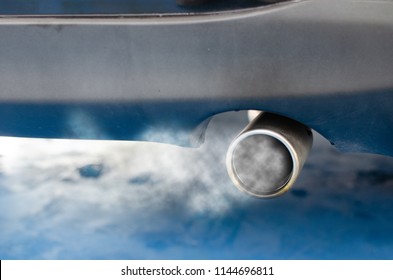 Car smog and air pollution from the exhaust pipe.