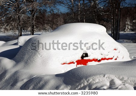 Car in a snowdrift. The car is Skoda 120.