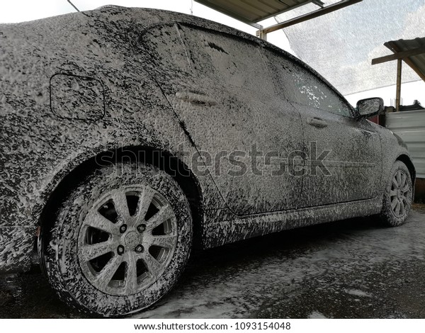 car in soap. carwash\
concept.\
\
