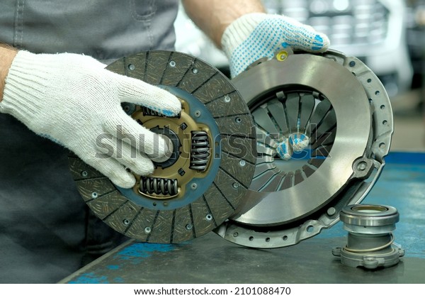 Car spare parts. The clutch kit is in the hands of an\
auto mechanic. Monitoring of the technical condition of the drive\
disc, the driven disc and the exhaust bearing. Repair and\
maintenance in a car s