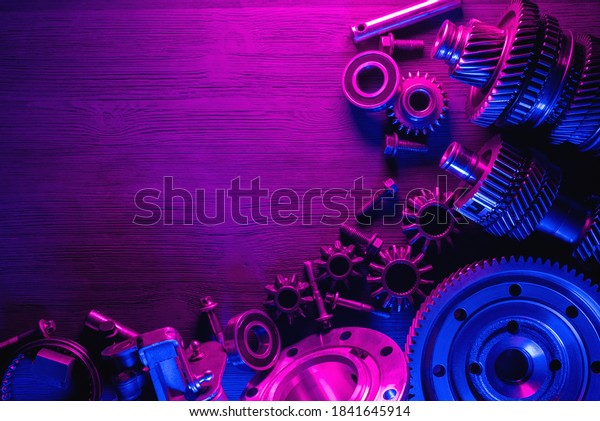 Car spare parts flat lay background.
Disassembled car gearbox parts on the
workbench.