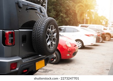 Car spare tire, spare wheel or off-road rear tire Parked in a shopping mall in Laos, Asia - Shutterstock ID 2273247701