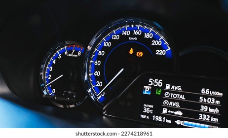 Car speed meter close-up with the speed driving electric car digital display screen. car digital speed meter dashboard modern automobile illuminated panel. Car dashboard modern automobile control.
