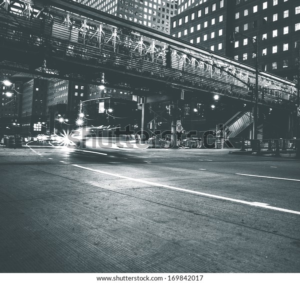 Car speeding in Lower Manhattan. Vintage black and white
processed 