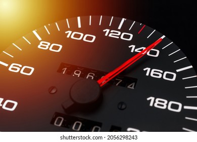 Car speedometer. Auto car speedometer shows 140 km h or miles.Closeup shot,dark black background.Automobile dangerous speed concept - Shutterstock ID 2056298243