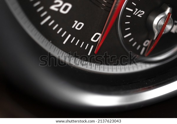 Car speedometer with red indicator close-up
view, luxury car interior background
