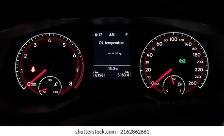 Car speedometer and RPM gauge at night
