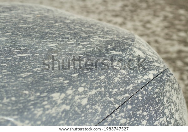 The car is splashed with\
mud. car after the trip. The surface of the vehicle is splashed\
with cement.