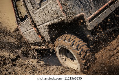 Car Splashing In Muddy Terrain