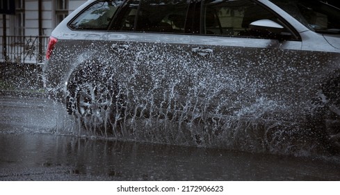 Car Splashing Water Going Trough A Puddle