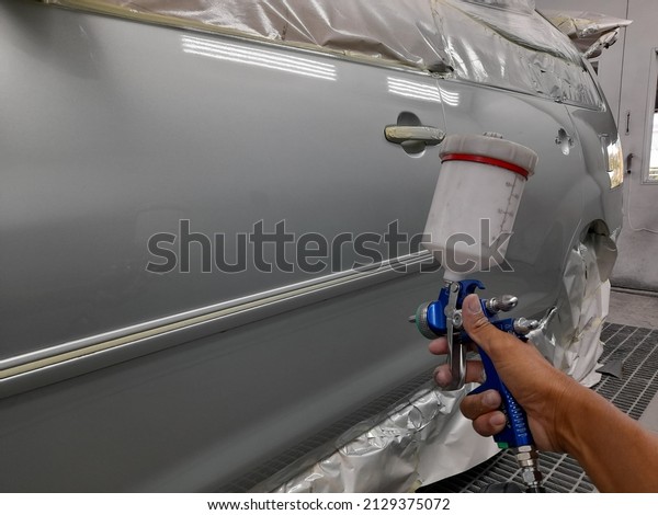 Car spraying in the\
garage