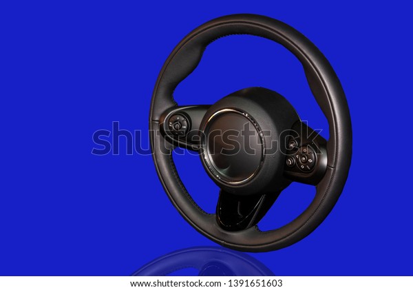 Car steering wheel, black technology, isolated\
from the white background