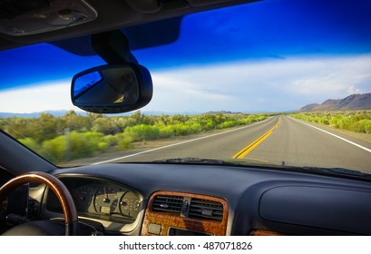 Car Steering Wheel And Dashboard On Road Trip Through Eastern Sierra, California